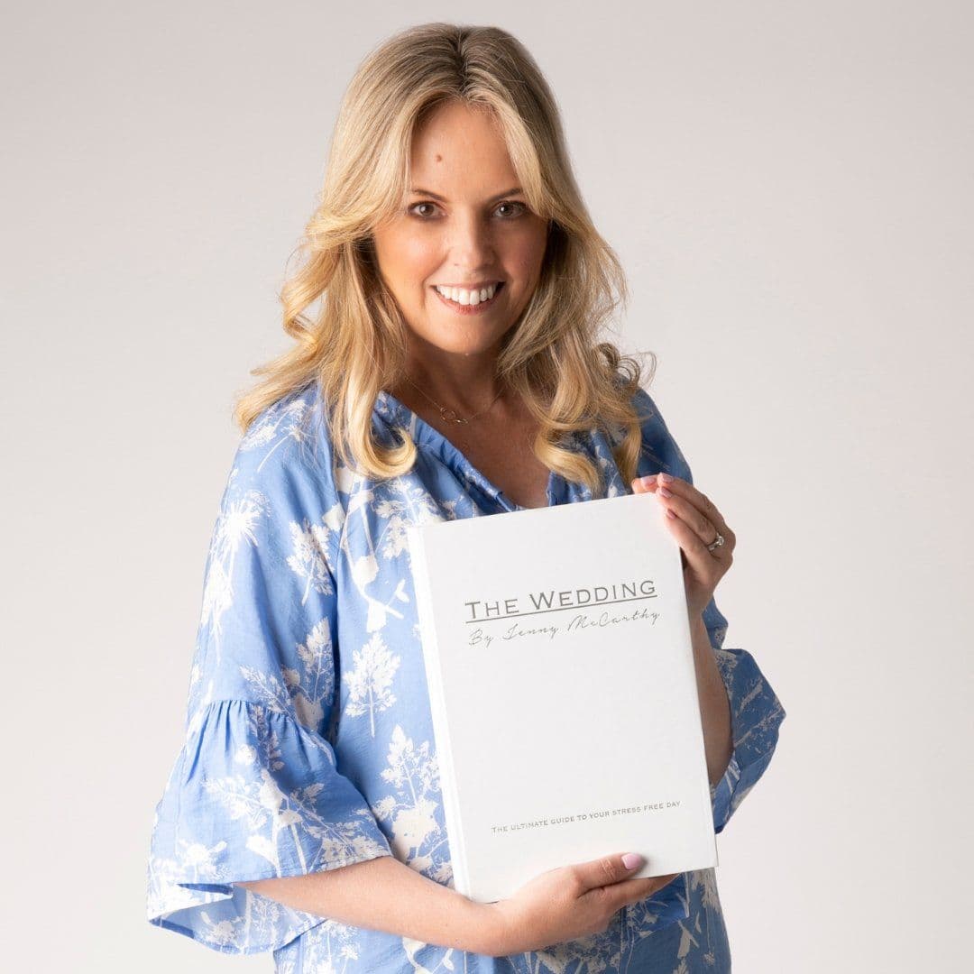 Jenny McCarthy holding her book, The Wedding